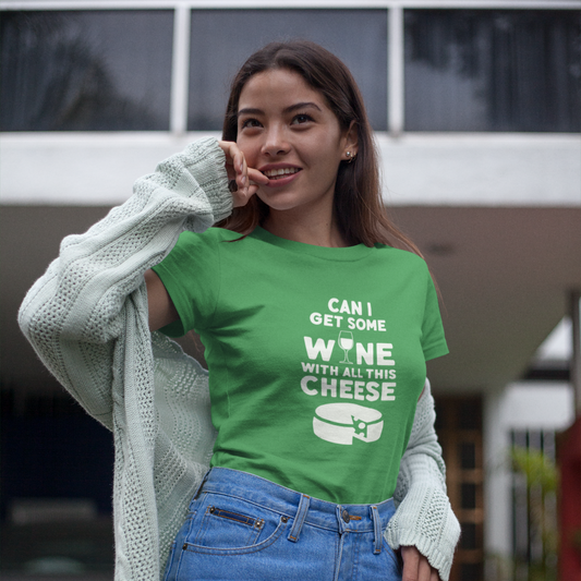 Woman wearing a green t-shirt with text and graphics, standing outdoors.