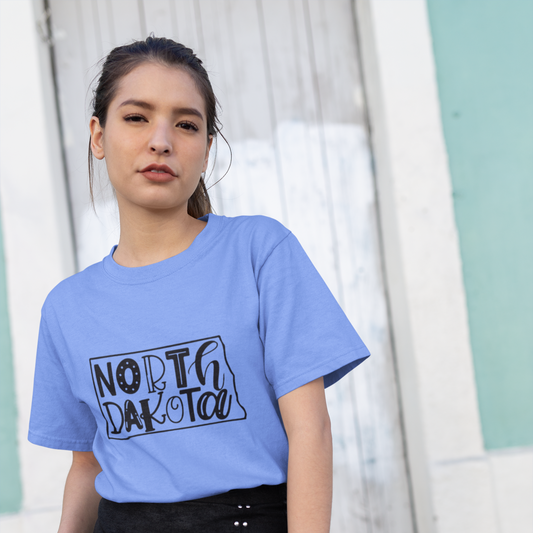Woman wearing a light blue t-shirt with 'NORTH DAKOTA' text and a black skirt.