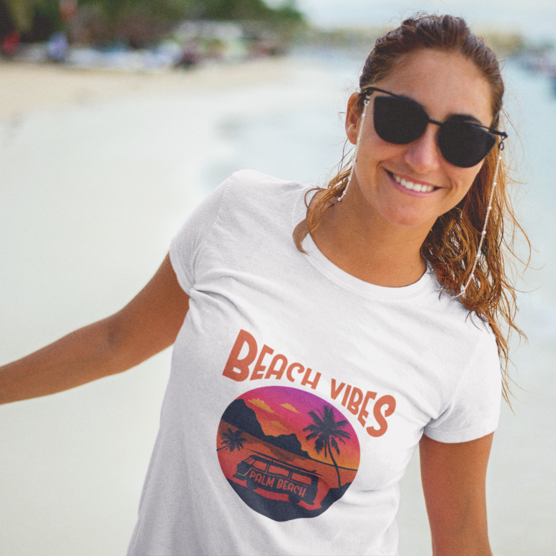 Woman wearing a 'Beach Vibes' t-shirt on a beach