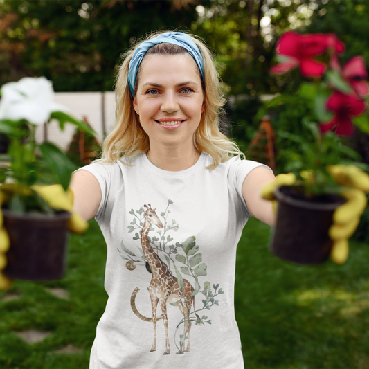 Woman wearing a t-shirt with a giraffe design in a garden setting
