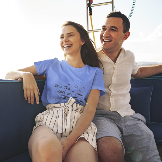 Man and woman sitting on a boat, smiling and enjoying each other's company.